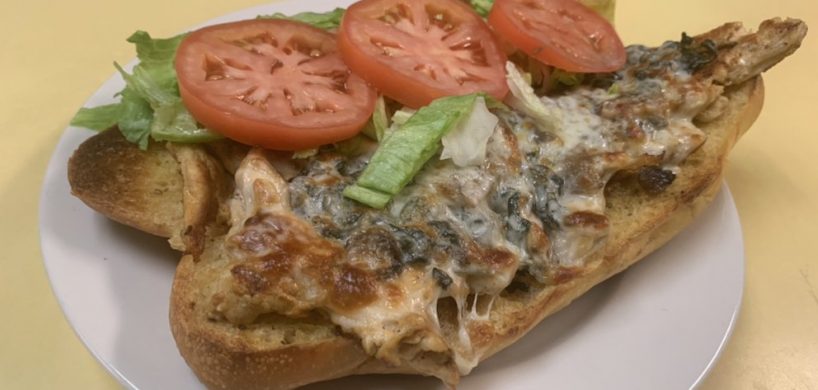 José’s Hoagie. This picture the pics grilled chicken with sautéed Mushrooms and onions, melted mozzarella cheese, lettuce and tomato on an open faced semolina sub Served on Johny’s countertop