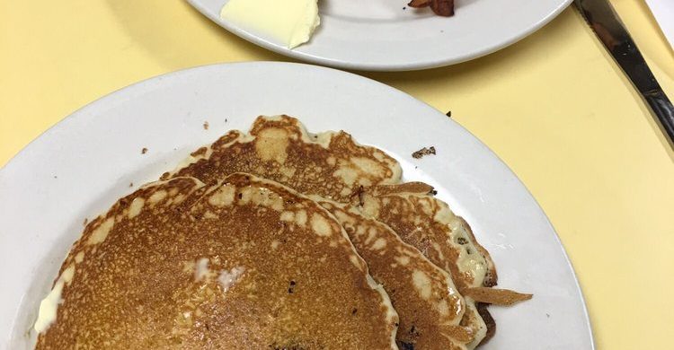 pancakes. This picture indicates an idea of what the pancakes and Johnys Luncheonette look like when you eat it in. It is a picture two orders of pancakes on Johny’s yellow counter